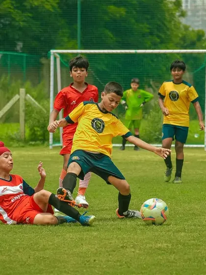 A sliding tackle wins the ball in a dramatic moment.