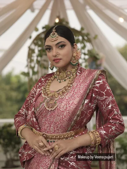 A regal and elegant look from a recent photoshoot. The makeup is classic and defined, with a winged eyeliner and traditional jewelry, creating a timeless portrait.
