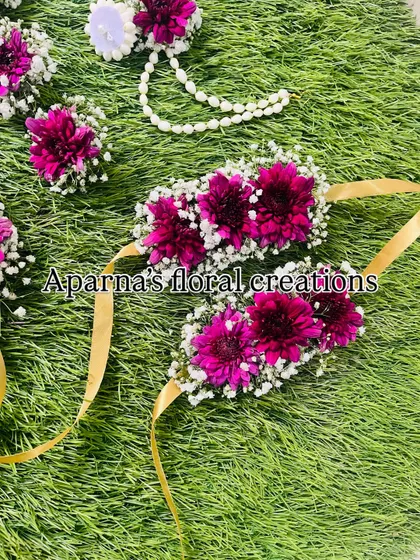 The bajuband (armlets) from the magenta set, designed with gold ribbons for tying.