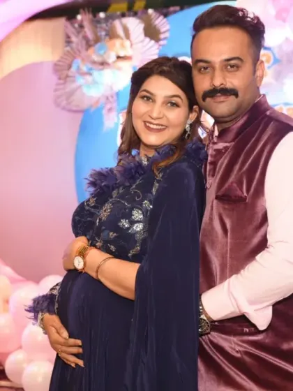 A tender moment between the parents-to-be. These candid shots, filled with smiles and affection, are just as important as the posed ones.