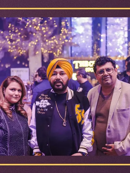 Our founders pictured with singer Daler Mehndi at a glamorous event, showcasing our presence at high-profile celebrity gatherings.