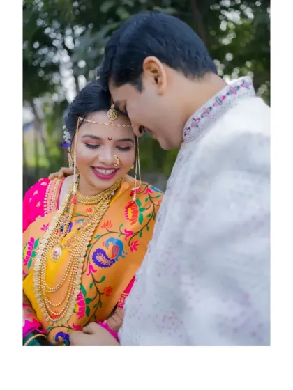 An intimate close-up of the couple, their smiles and gentle touch conveying their deep affection.