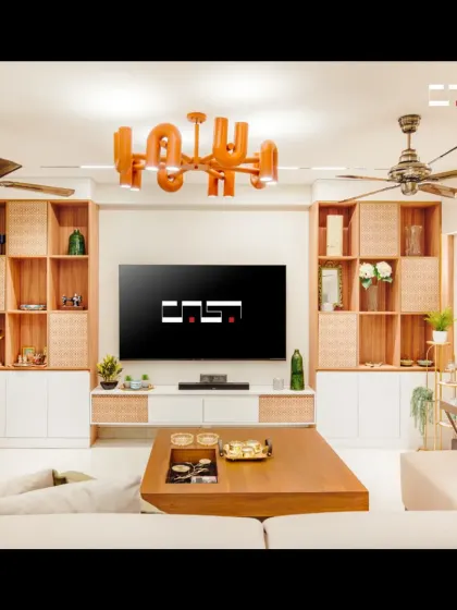 This view highlights the symmetrical design of the media wall, flanked by wooden shelves with rattan accents that provide both storage and a touch of natural texture.