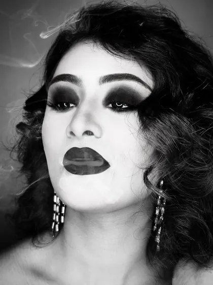 There is a unique power in monochrome. This black and white look plays with smoke and shadow to create a dramatic, high-fashion effect, proving that true glamour doesn't always need color.