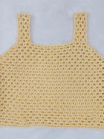 A flat-lay of the Ophelia Tank Top, showing the delicate mesh stitch and clean construction.