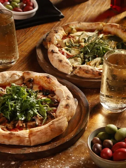 Our pizzas taste like they're fresh from the streets of Naples. This flatbread, oozing with cheese and packed with flavor, is the ultimate comfort meal with rich, elegant flavors.