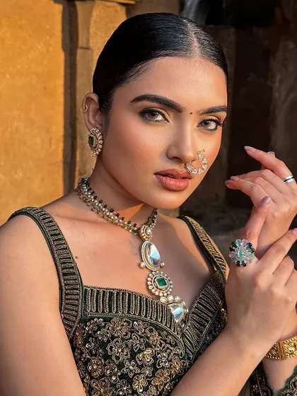 This shot highlights the beautiful jewellery and the way the makeup complements it, creating a cohesive and stylish look.