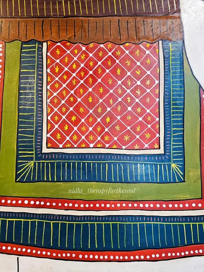 The rich patterns of the carpet on the elephant's back are a testament to the detail in Cheriyal art. Each line and color is carefully chosen to create a vibrant textile effect.
