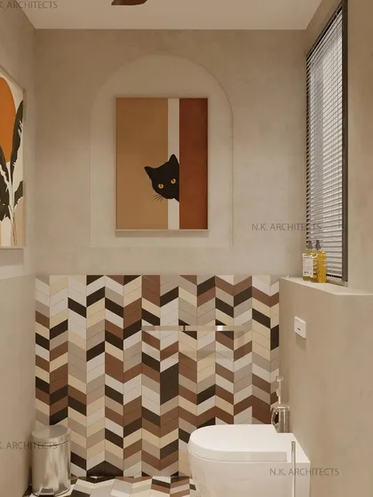 A playful and creative kids' washroom. The design uses a beige color palette, a chevron-patterned tile accent wall, and fun, quirky art to create a whimsical atmosphere.