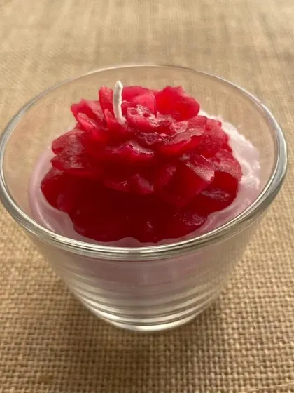 These handmade scented soy candles in a glass make lovely party favors or return gifts. This one is a beautiful rose design.
