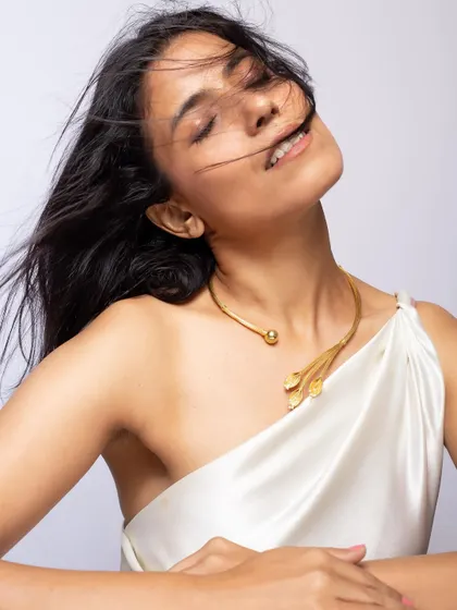 An expressive shot featuring a unique leaf-motif choker, demonstrating how to create a mood that complements the jewellery's design.
