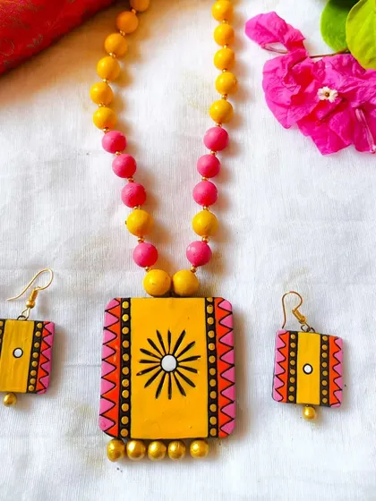 The rectangular pendant set in a cheerful yellow and pink combination.