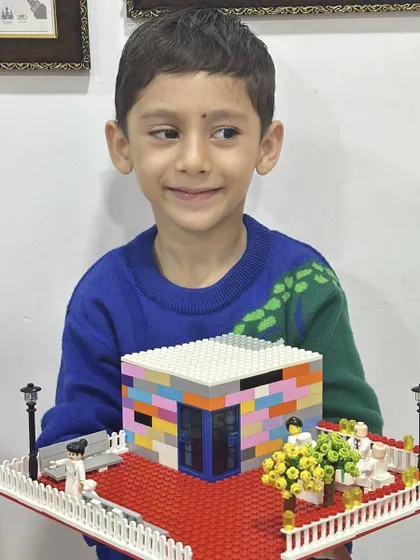 Another beautiful LEGO house model, showcasing a different design and color palette, highlighting the individual creativity of each student.
