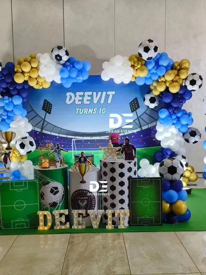 I love bringing unique party themes to life. For a young football fan's 10th birthday, I designed a complete stadium experience, including a themed backdrop, goalposts, player cutouts, and balloon pillars in team colors.