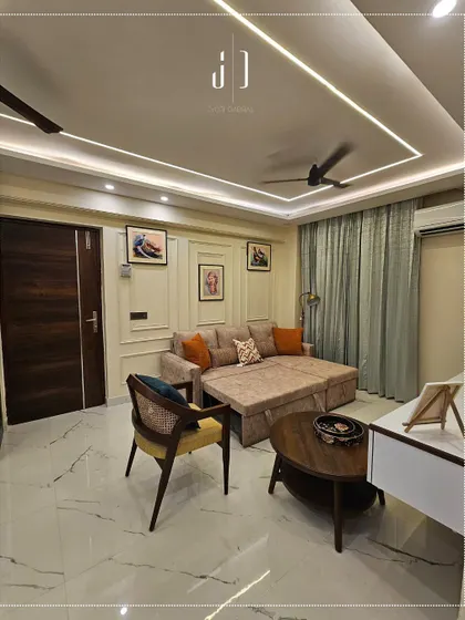 This living area features a versatile sofa-cum-bed, perfect for accommodating guests in a compact apartment. The design proves that you don't have to sacrifice style for functionality.