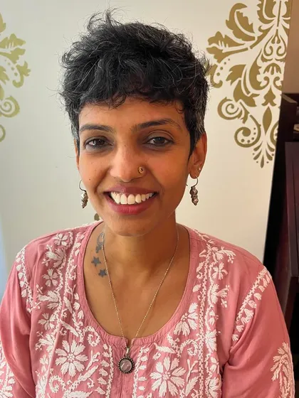 A textured pixie for Anusha's thick hair. I kept it looking feminine and soft.