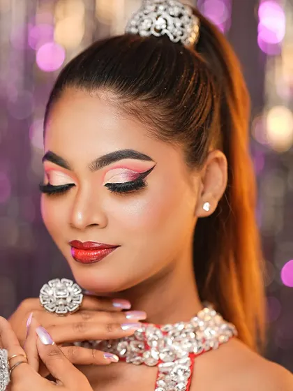 A detailed shot of the sunset-toned eyeshadow with a sharp wing, a popular and versatile eye look.