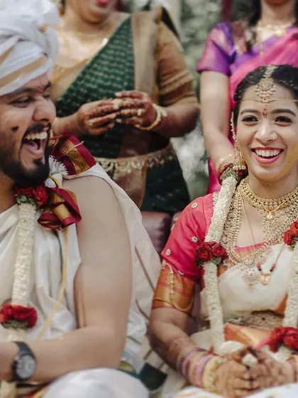 The shared laughter between this couple during their traditional Brahmin wedding is infectious. It’s a perfect example of a candid moment that captures the spirit of the celebration.