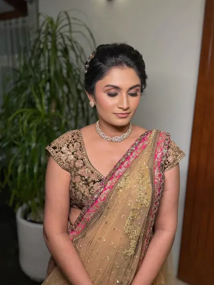 A close-up of the luminous dewy skin and accentuated eyes that define this refined and elegant evening look.