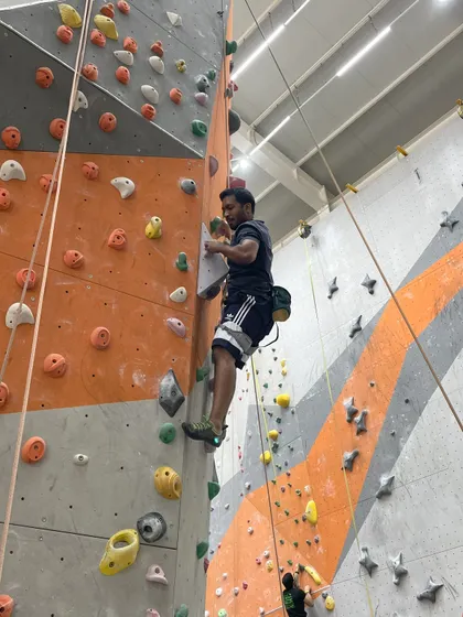 A climber tackles an overhanging route, a true test of upper body and core strength.