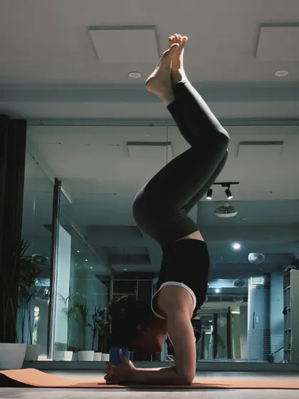 Finding stillness in a forearm stand, or Pincha Mayurasana. This inversion requires a lot of practice to find the right balance point, engaging the entire body from the forearms to the core and toes.