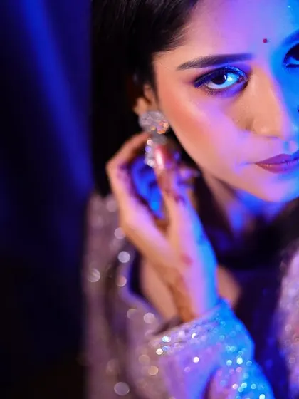 A striking portrait of the bride-to-be, using bold, colorful lighting to create a contemporary and fashionable look.