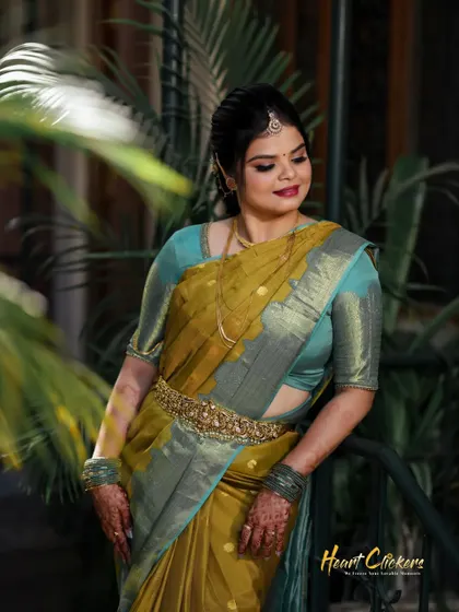 A beautiful portrait of the bride, with lush green plants providing a natural and fresh background.