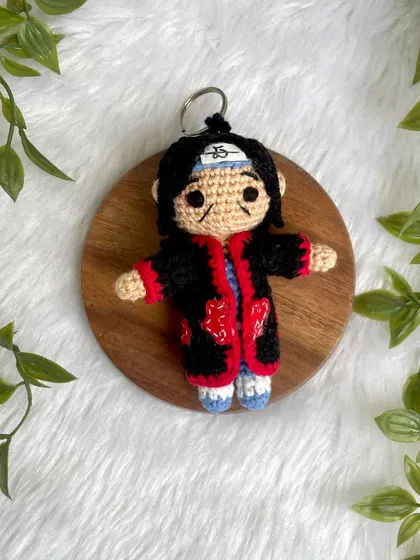 A mini Itachi Uchiha from Naruto, made as a keychain. It's perfect for anime fans to show off their favorite character on their bag or keys.