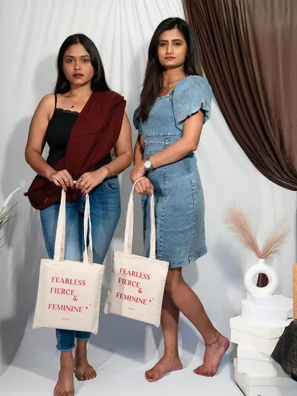 Bold women deserve bold statements. My friends modeling our custom tote bags, which are more than an accessory; they're a celebration of strength and style.
