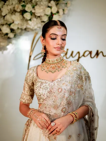 This picture is what dreams are made of. The bride's eyes are closed, showcasing the beautiful, soft-glam eyeshadow work. The overall look is serene and angelic.