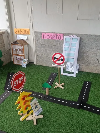 Our miniature community setup, featuring a school, hospital, and traffic signs, ready for imaginative play.