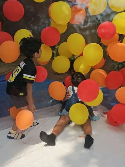 Kids playing amongst the 'fireballs' in the inflatable tent.