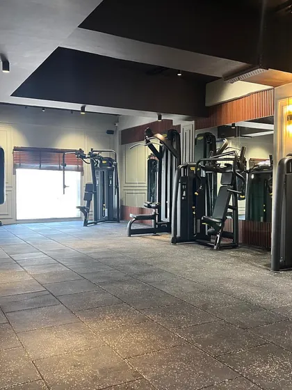 The spacious and well-organized functional training area, complete with a punching bag and various strength machines.