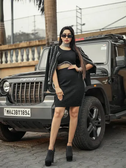 A confident pose that ties the model, fashion, and prop together perfectly.