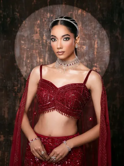 This composition highlights the elegant cut of the blouse and the way the jewelry complements the outfit, showing a keen eye for styling details.