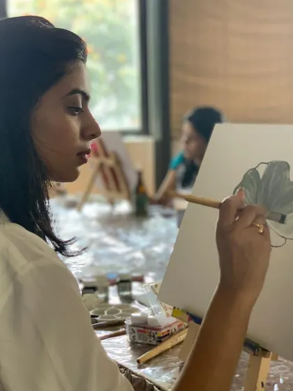 A guest sketching out her design before starting her gold leaf painting. We guide you through the entire process, from concept to completion.