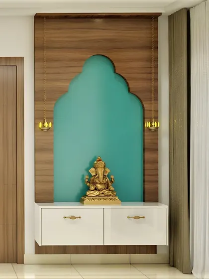 A minimalist wall-mounted pooja unit with a wooden back panel and a distinct arch-shaped niche. The floating white cabinet and two hanging lanterns add a touch of modern elegance.