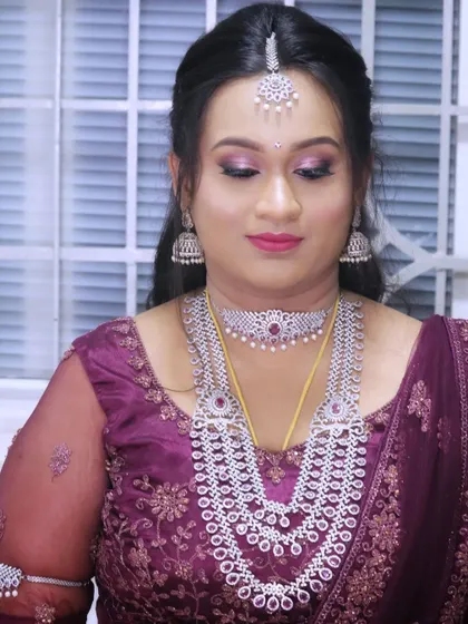 A full view of a glamorous reception look, showcasing the intricate diamond jewelry and the flawless makeup.