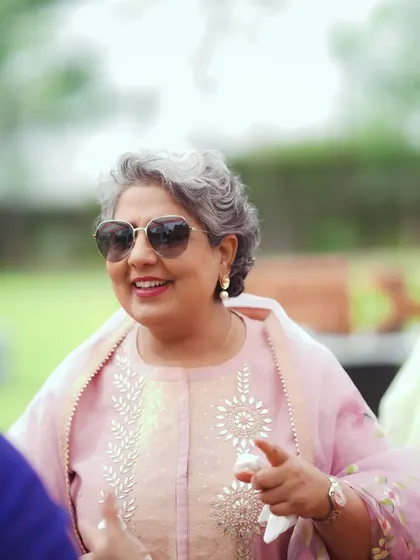 A stylish guest enjoying the outdoor festivities. I love capturing the unique personalities of everyone who comes to celebrate with you.