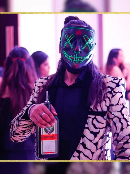 Adding a dash of mystery and flair to the party. Our masked marvel is ready to serve, bringing a unique and theatrical element to the night's entertainment.