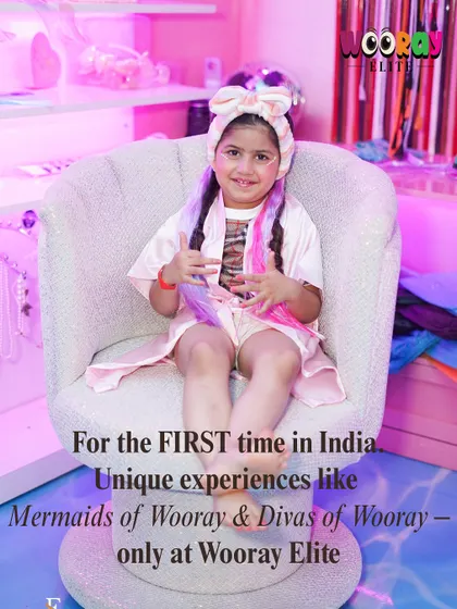 For the first time in India, we bring you exclusive experiences like 'Mermaids of Wooray' and 'Divas of Wooray'. This little diva, with her colorful hair and robe, is all set for her unique pampering session.