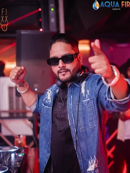Another action shot from a packed weekend at The Fixx Bar. The denim jacket look is a classic for a reason, keeping it cool while the dance floor heats up.