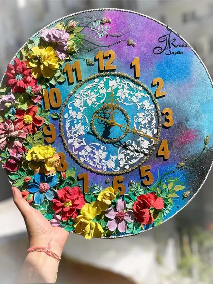 This 22-inch galaxy-themed wall clock shows how we can play with unique concepts. The deep blues and purples of the background are complemented by a burst of colorful 3D flowers, creating a functional piece of art that is truly out of this world.