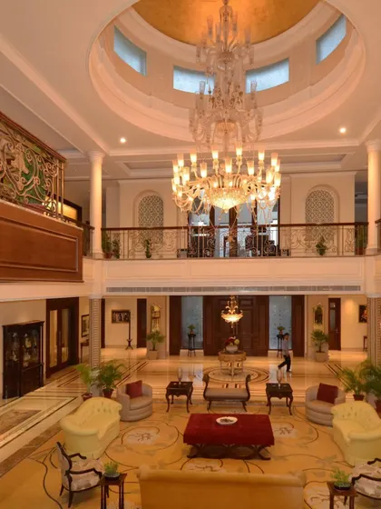 An indulgence in the splendor of neo-classical architecture. This double-height lobby features opulent chandeliers, intricately carved pillars, and breathtaking jaali windows, creating a realm of refined luxury.