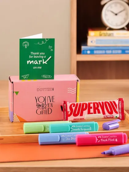 A simple and sweet gift for a teacher, this box contains highlighters, a protein bar, and a card that says "Thank you for leaving a mark on me."