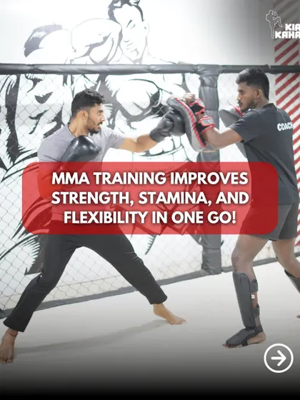 A student works on his striking combinations with a coach holding pads. This one-on-one attention helps improve strength, stamina, and flexibility all in one go.