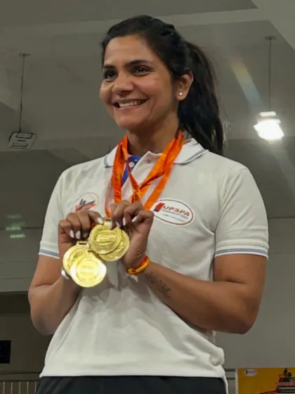 Proudly holding my gold medals after winning the Strong Woman trophy at the UP States Classic Powerlifting Championship. Every competition teaches me lessons to come back even stronger.