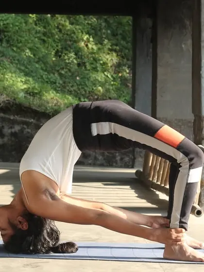 Here I am in Urdhva Dhanurasana (Wheel Pose). While yoga improves flexibility, its true purpose is to help you find yourself. Asanas and Pranayama help raise your energy and bring clarity to your mind.