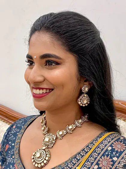 Charm and elegance, all at once. This look for a pre-wedding event features classic winged eyeliner and a beautiful red lip.