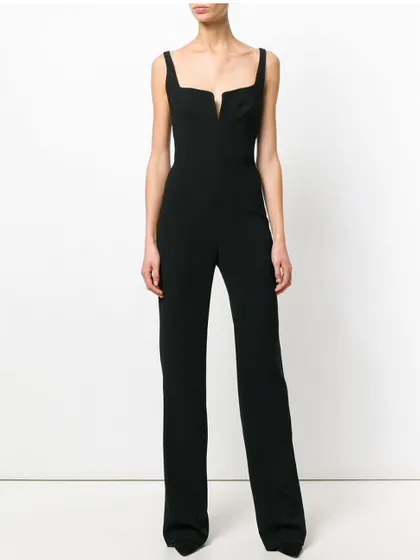 For a sleek and modern alternative to a dress, I design custom jumpsuits. This black crepe couture jumpsuit features a unique cut-out detail at the neckline and a straight-leg cut for a long, lean look.